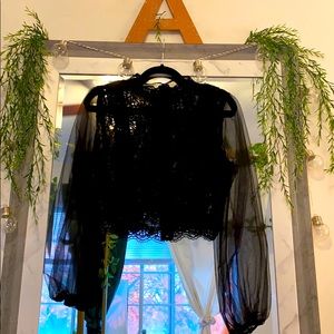 Black long sleeve crop style top.